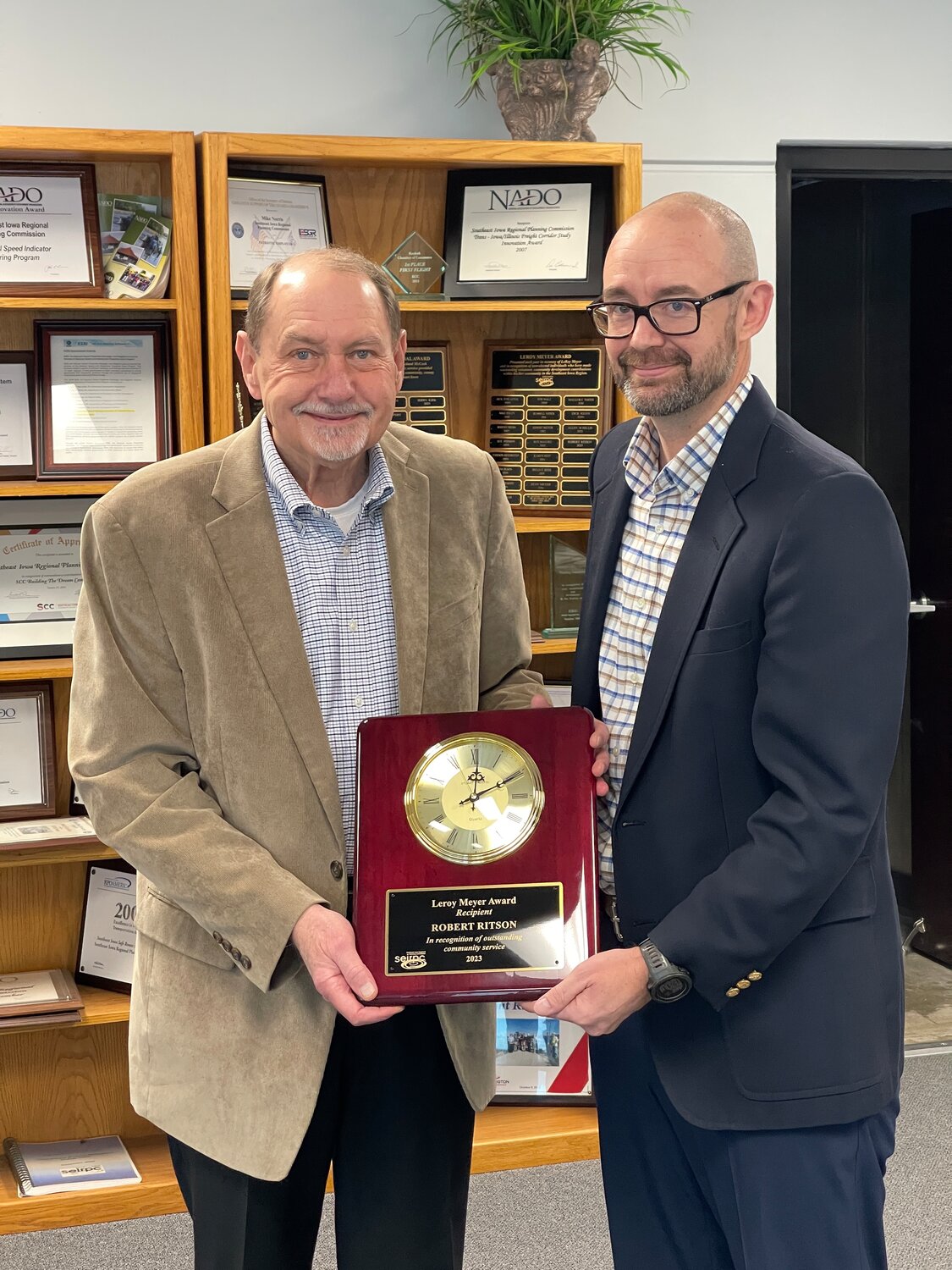 Burlington's Robert Ritson accepts the LeRoy Meyer Award from SEIRPC's Mike Norris this week following the groups' January board meeting.