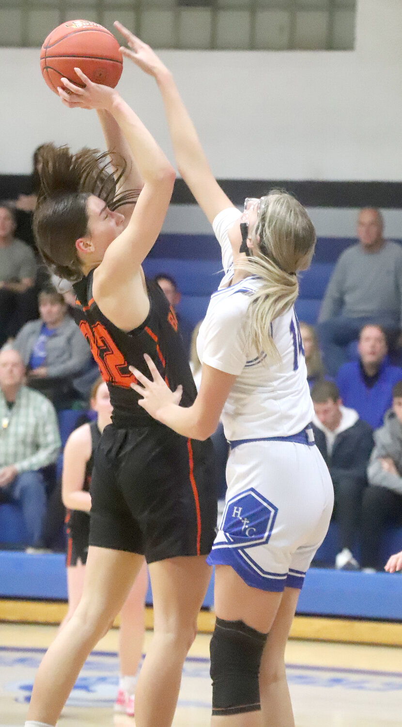 HTC sophomore Presley Myers gets a block on a Mediapolis block Monday night at Holy Trinity in the Crusaders 48-35 win.