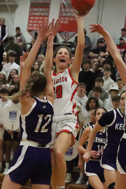The Lady Hounds' Hadley Wolfe slides through for a floater in the lane in the third period of Friday's loss to Keokuk in the Hound Dome.