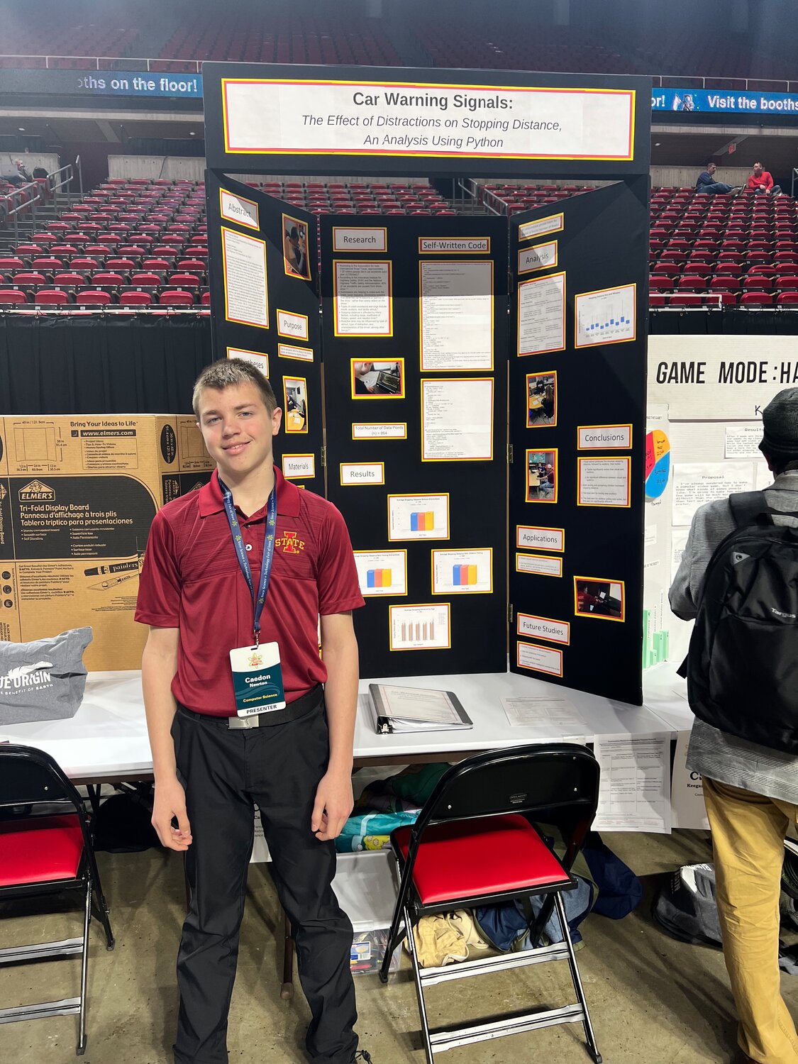 Central Lee 8th grader Caedon Newton shows his project on gauging distracted driver reaction times at a recent STEM event. Newton will be traveling to Washington D.C in April to attend the National STEM Festival.