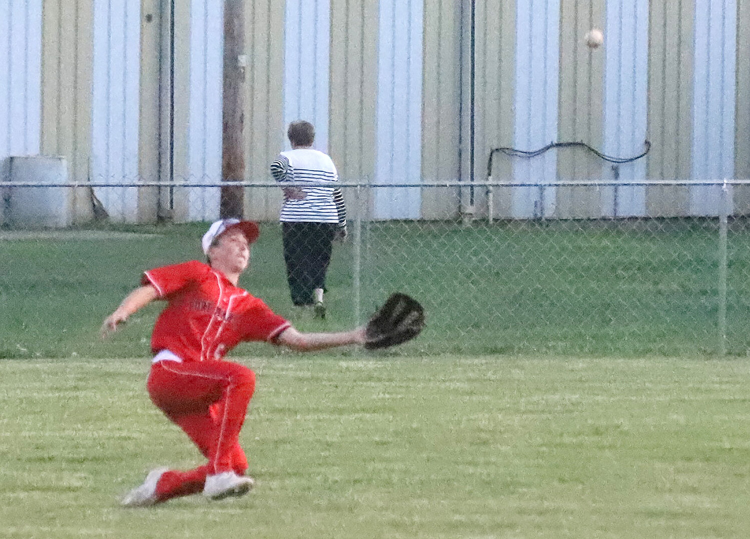 Fort Madison incoming freshman Owen Huffman makes a sliding catch to rob Central Lee's Kayden Calffee of a hit in the top of the 4th inning Monday night in Fort Madison. The Hounds won 2-1 and have moved to 3-0 to start the year.