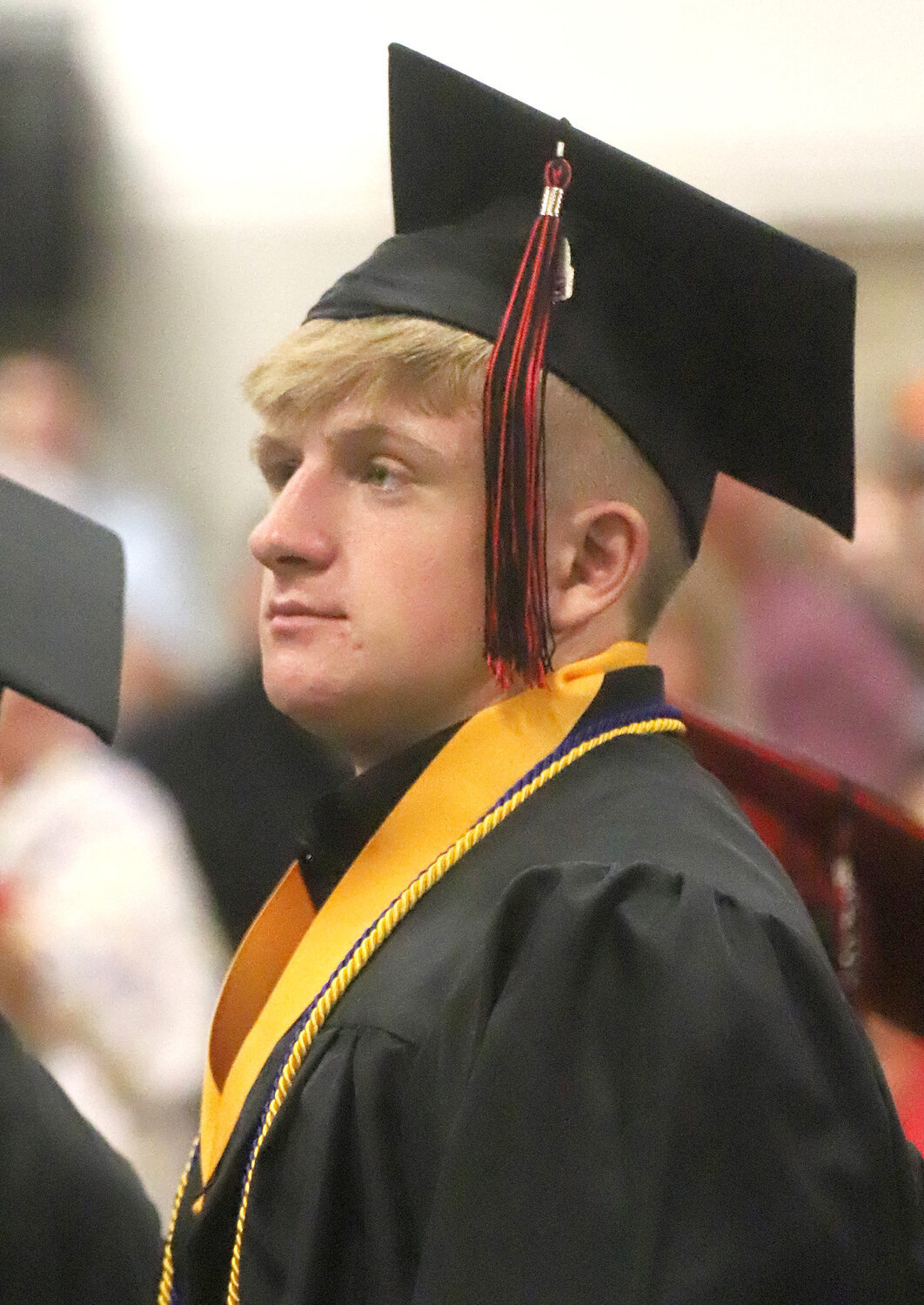 Senior Henry Morris takes one final look at the graduation stage at Fort Madison High School Saturday morning. Morris was one of 130 Bloodhound graduates.