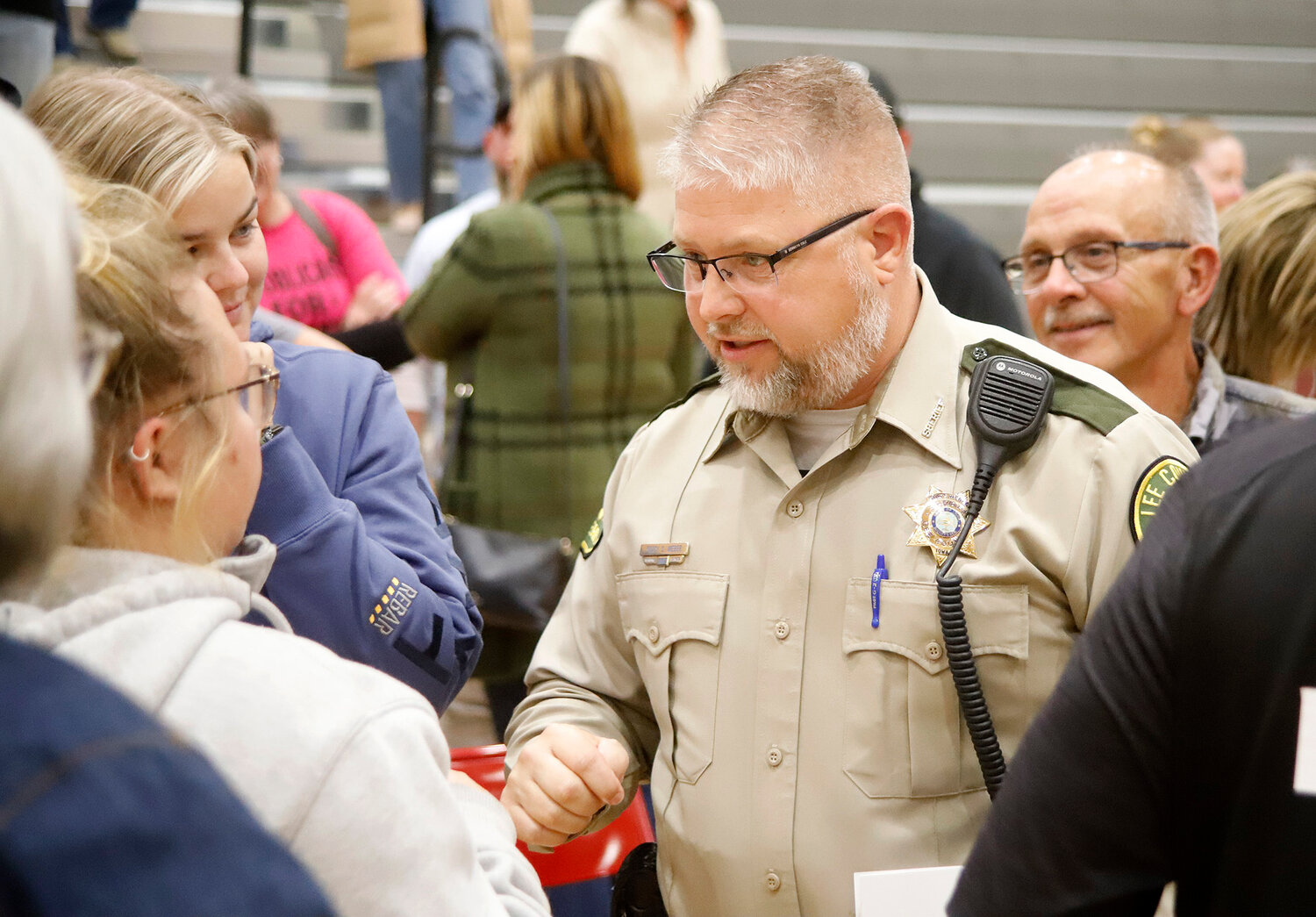 Lee County Sheriff Stacy Weber talks with forum attendees following a two-hour debate sponsored by the Lee County Republicans Tuesday night. Weber is challenged by former Lee County deputy and Wyoming State Trooper Elliott Vandenberg.