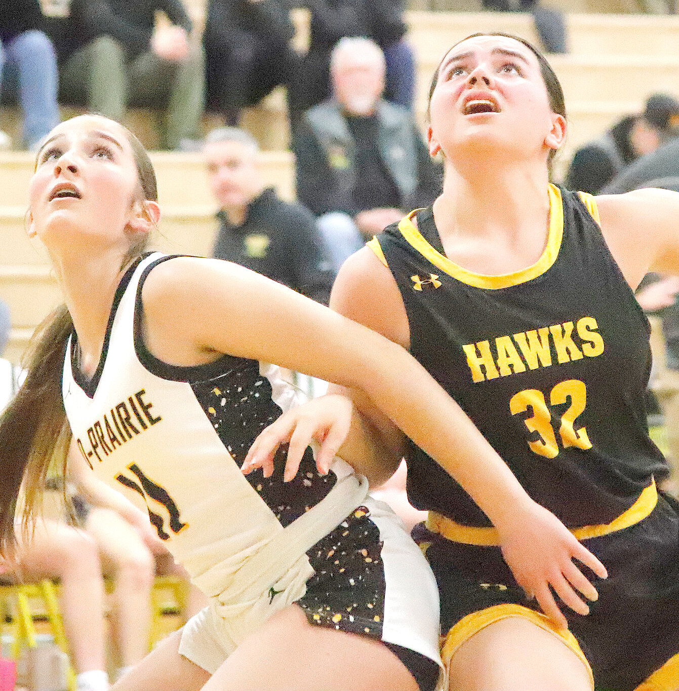 Central Lee's Kenna Sandoval looks for a rebound following a free throw in Saturday's game in Wellman at Mid-Prairie. The Hawks fell 71-44 bringing their season to a close