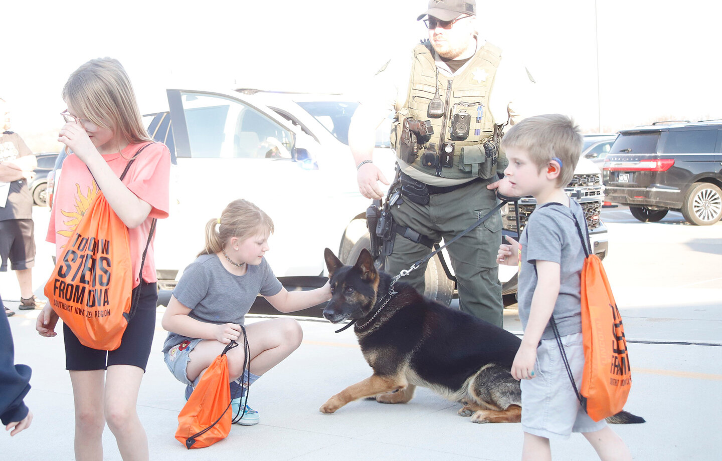 Students pet Kion the Lee County Sheriff's Department's K9 officer. Handler Jordan Maag oversees the interaction as part of the Fort Madison Elementary School S.T.R.E.A.M. night at Fort Madison Elementary School.