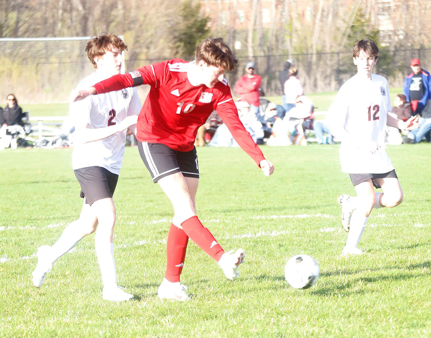 Fort Madison's Henry Graham punches a shot into the goal in the second half of Monday's 4-0 win over Fairfield in the Southeast Conference home opener for the Bloodhounds.