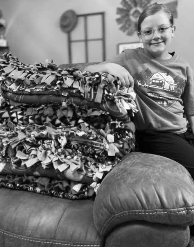 EJM-SMS student Brookelyn Stout with her hand-tied blankets donated to Hardin County Strong. COURTESY PHOTO | SILSBEE BEE