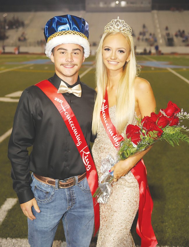 Lumberton High School seniors Dylan Gigliotta (left) and Ashleigh Roder were named as the homecoming king and queen during a halftime ceremony during the Raiders&rsquo; 24-21 win over the Brazosport Exporters on Sept. 24.