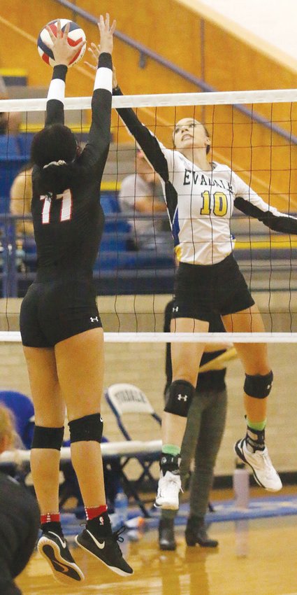 Evadale hitter Hope Miller (10) slips the ball past a Hull-Daisetta defender during the Lady Rebels' District 24-2A win at home on Oct. 1.