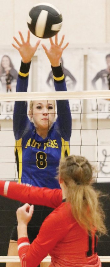 Evadale&rsquo;s Whitley Carter (8) blocks a shot against the Lady Rebels&rsquo; 3-0 win over the Hull-Daisetta Lady Bobcats on Oct. 29 at West Hardin High School.