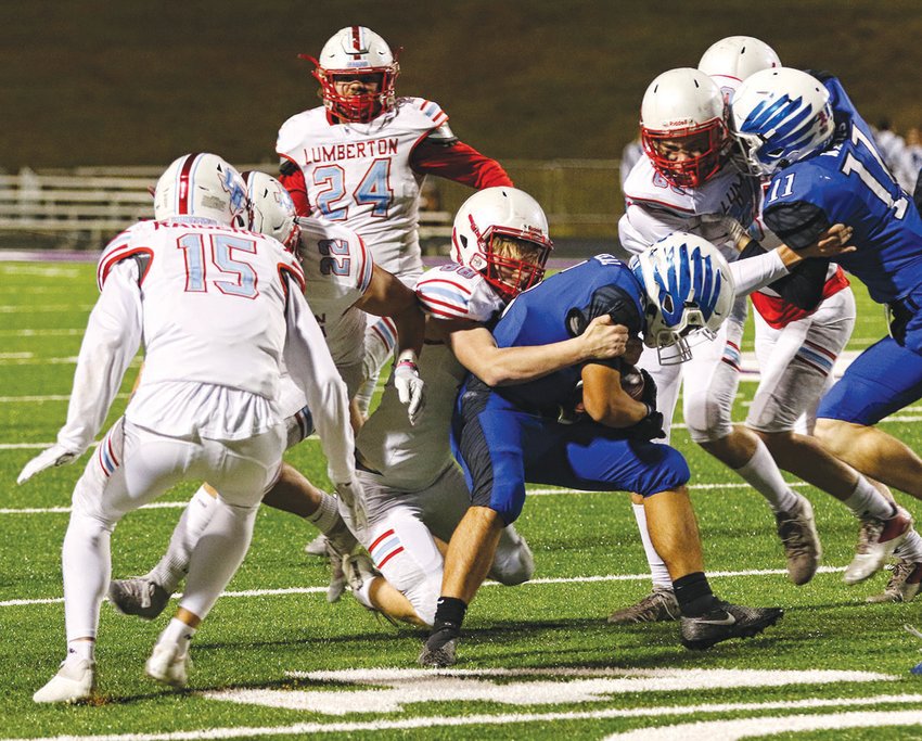 A host of Raider defenders come up to help stop a Lindale ball carrier in Class 4A Division 1 bi-district action on Nov. 12.