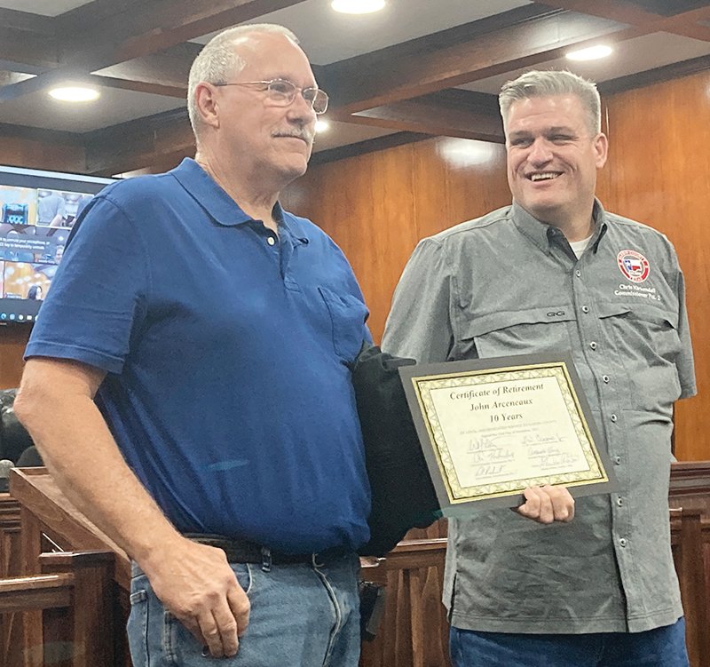 John Arceneaux (left) received his Certification of Retirement after serving 10 years as the maintenance supervisor for the county. He was presented the award by Judge Pro Tem Chris Kirkendall (right) during the Nov. 23 meeting of the Hardin County Commissioners Court.