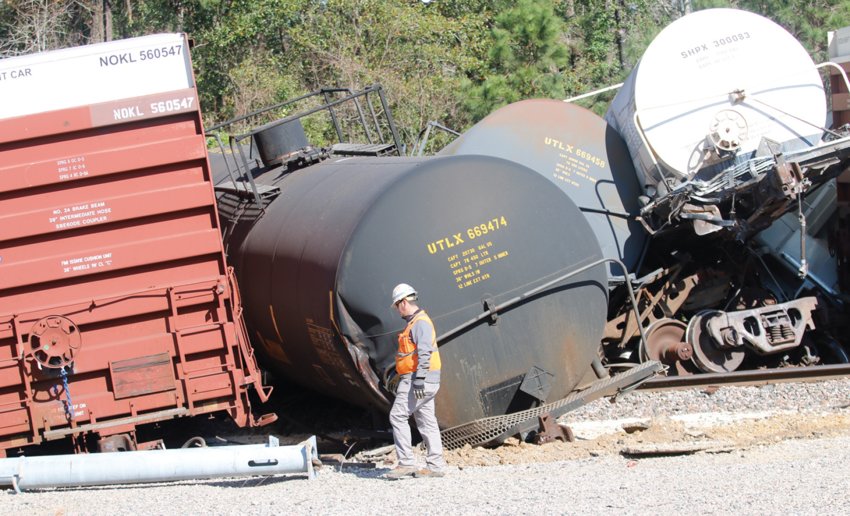 A BNSF employee examines the nine cars that derailed on Jan. 2 in the Silsbee yard near the intersection of Martin Luther King Jr. Drive and Lee Miller Road.