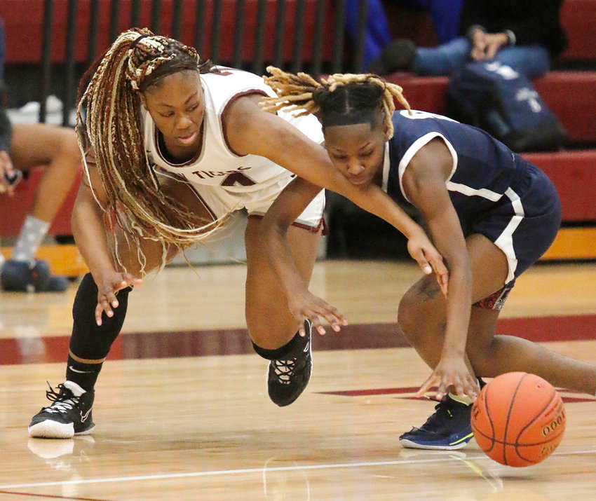 Silsbee&rsquo;s Ca&rsquo;driane Martin (20) battles a West Orange-Stark player for possession of a loose ball during first-half action at home on Jan. 14.