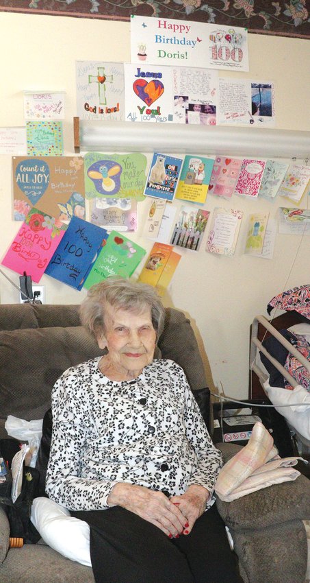 Dorish Hartman proudly displays the birthday cards she has received for her 100th birthday.