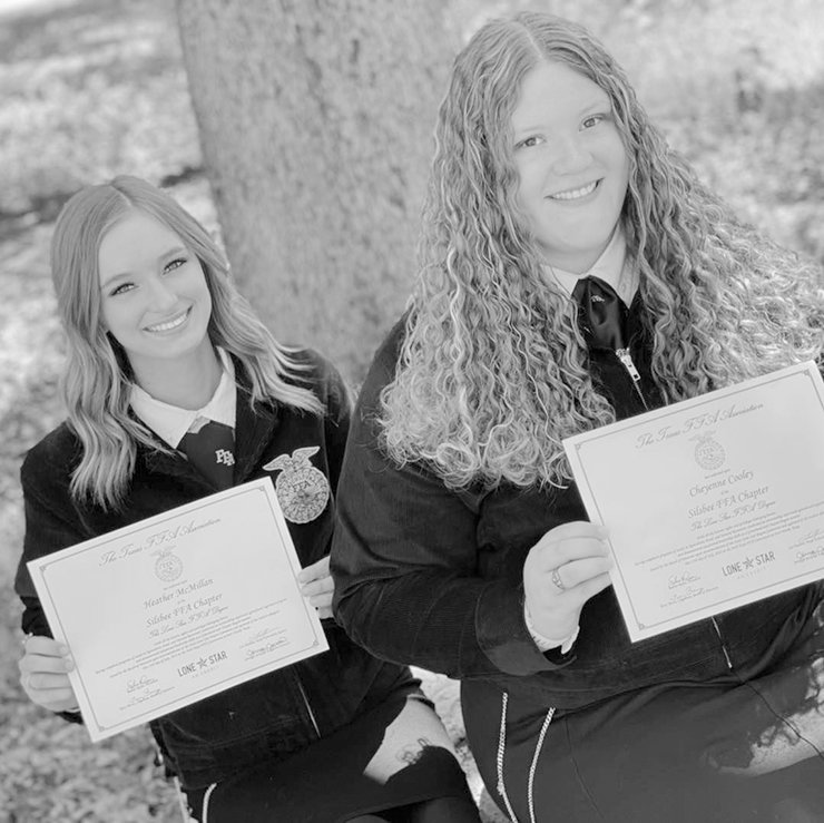 Heather McMillan and Cheyenne Cooley (left to right) displaying the Lone Star Degree they recently received at the FFA State Convention.