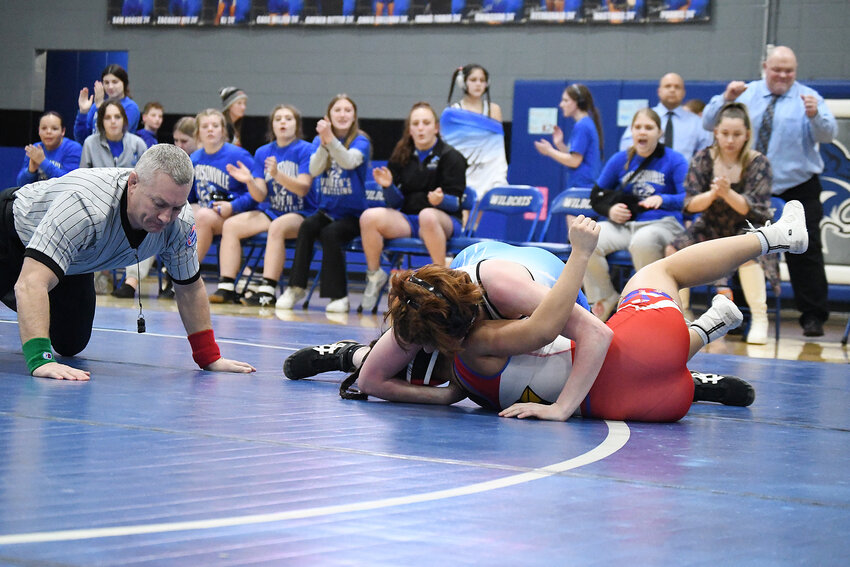 Harrisonville’s Rylie Ingrassia pins Clinton’s Mia Bagley during last week’s senior night dual. Ingrassia also won the 120-pound weight class at Winnetonka Invitational over the weekend.
