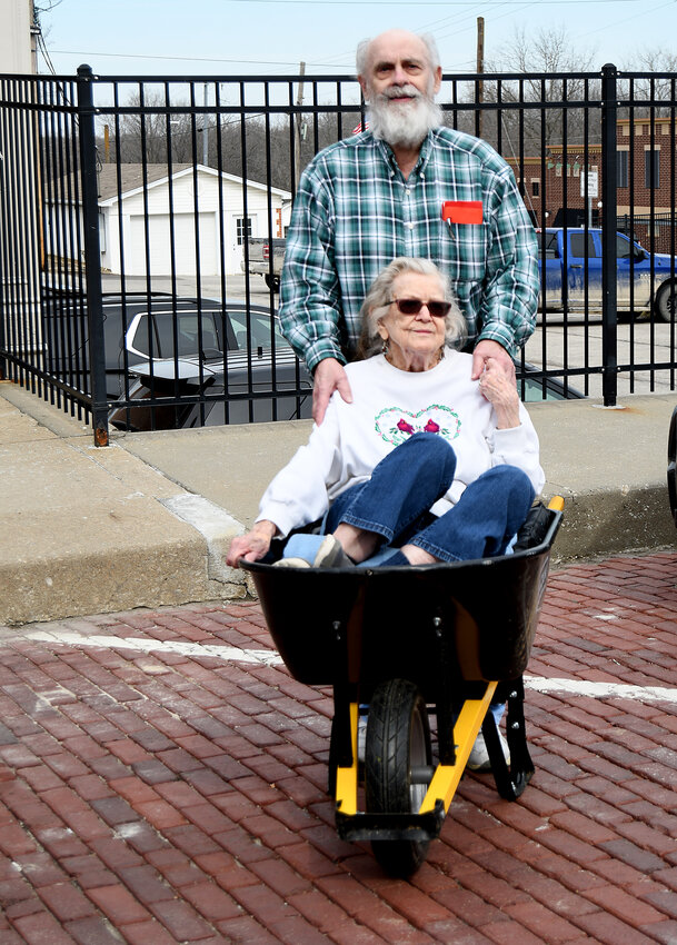 Harrisonville residents Earl and Barbara Lash reenacted their wedding day photo last week to celebrate their 70th anniversary. After their wedding on Feb. 21, 1954, Earl pushed Barbara aroud the Harrisonville Square in a wheelbarrow.