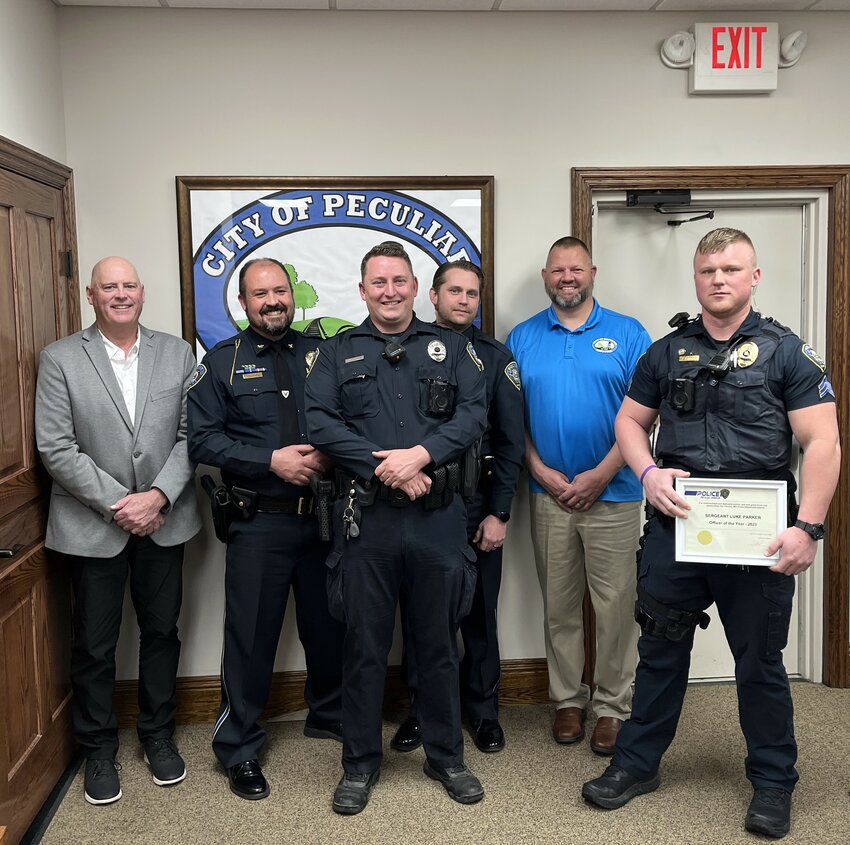 Peculiar police officers Phillip Grabmiller, Alex Goodman and Luke Parker were recognized Monday night. Pictured with them are Peculiar Mayor Doug Stark, Chief Don Shepard and Alderman John Shatto.