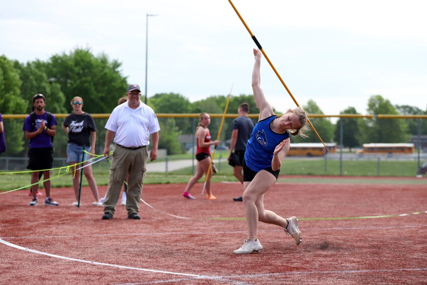 Harrisonville sophomore Paige Cribbs throws the javelin at last year’s district meet, where she set her best mark of the season. Last week, Cribbs broke that mark, and in doing so broke her own school record. She won the event the Smithville Invitational with a throw of 36.44 meters (119 feet and 6.75 inches).