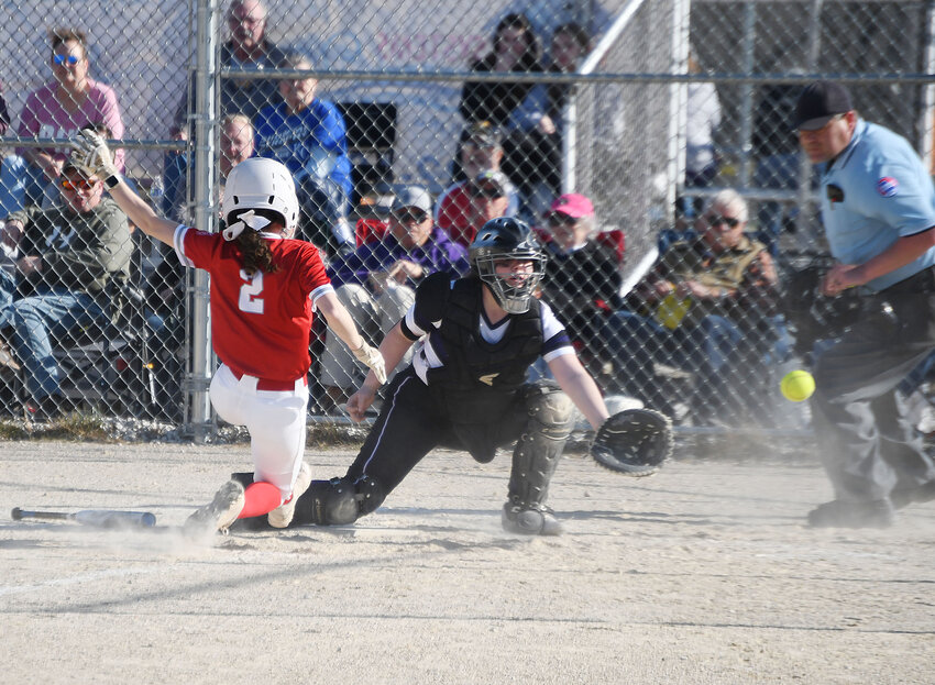 Archie’s Layla Septer (2) narrowly beats the throw to home plate to score a run for the Lady Whirlwinds during last week’s game at Midway. Archie won the game 17-2.