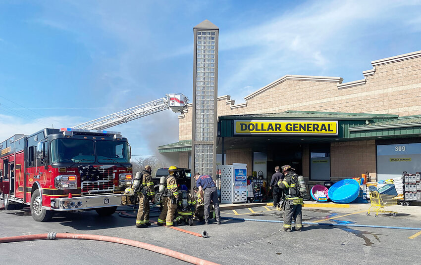 Firefighters battled a fire at the Dollar General store at the intersection of Mechanic and Commercial streets in Harrisonville.