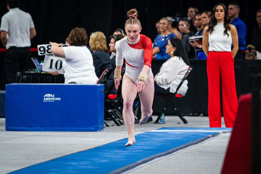 Dakota Essenpries, a 2023 Adrian graduate, begins her approach for the vault at a meet this season. Essenpries, a freshman at the University of Arkansas, and her team will be competing at the NCAA Championships on Thursday. The event will be televised on ESPN2.