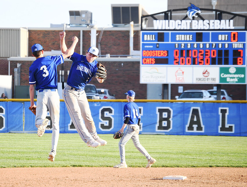 Harrisonville senior Drew Wright (3) and sophomore Leiv Hall celebrate beating rival Pleasant Hill. The Wildcats won 8-7 after scoring five runs in the fifth innning. The win ended a four-game losing streak in the series for Harrisonville.