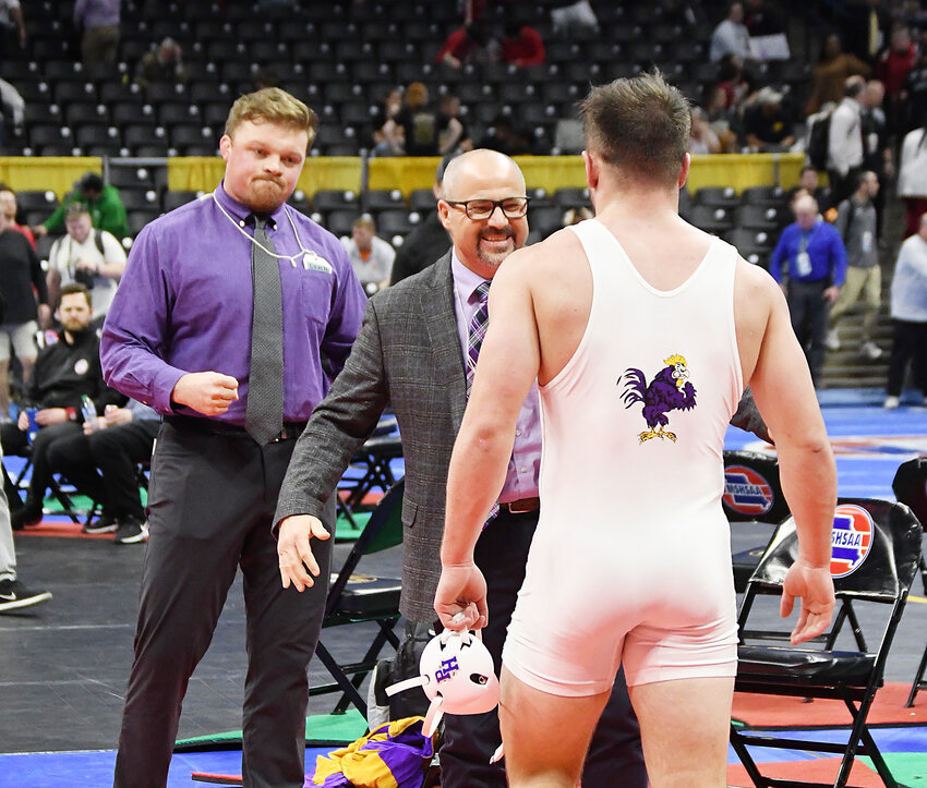 Pleasant Hill senior Brayden Bush, right, is congratulated by coaches Alec Rentschler, left, and Jeff Wyatt after winning his state title. Following the season, Wyatt resigned after 14 years as head coach. Rentschler was recently hired as the next head coach of the wrestling program.