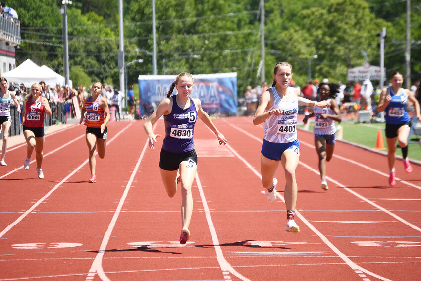Pleasant Hill junior Brooke Beck (5) crosses the finish line just ahead of Delaney Brinker of Ladue Horton Watkins in the 400-meter dash finals at the Class 4 state track and field meet Saturday. Beck repeated as the 400 dash champion, breaking her own school record in the process. The new record is 54.92 seconds.