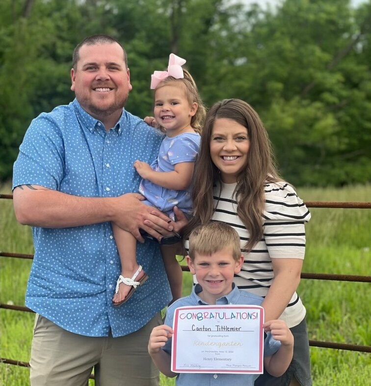 Kasey Tittlemier and his family have moved around several times from Missouri to California to New Mexico and now back to Missouri during the last several years. Tittlemier is the new Sherwood football coach. He will also oversee the weights program at the school. He is pictured here with his wife, Mary, son, Canton, and daughter Micki.