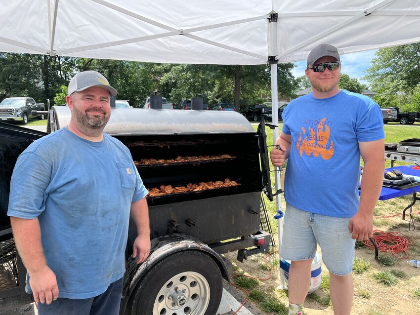 Drew Powers and Grant Gilkeson, of Harrisonville Community Church, brought their best game in grilling fresh chicken for the Smoke’n for Jesus competition.