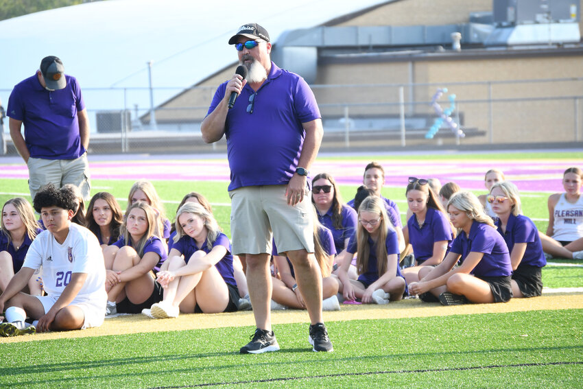 Pleasant Hill girls golf coach Eric Bloom talks about his team Aug. 19 during the annual Purple and Gold Night at Eklund Stadium.