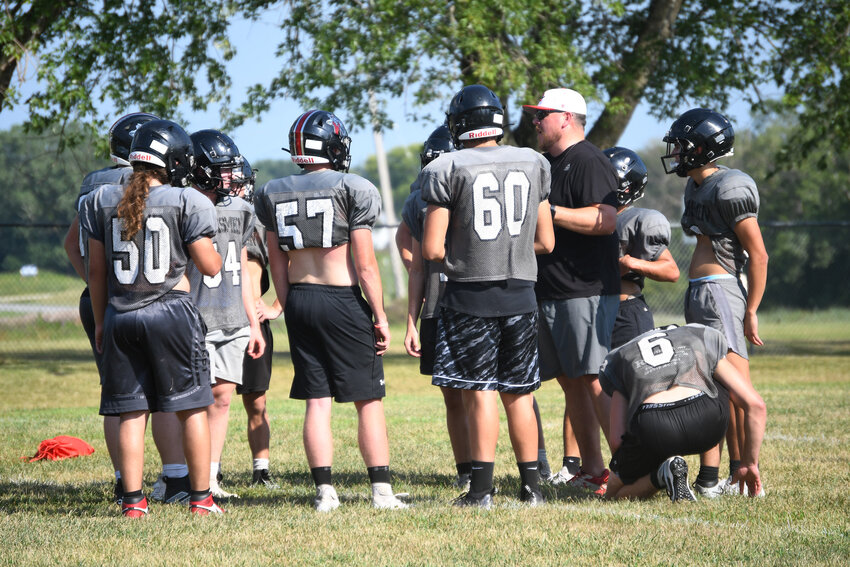 Sherwood coach Kasey Tittlemier gives his offense a play call during practice earlier this month. The Marksmen host Adrian at home Friday night to begin the season.