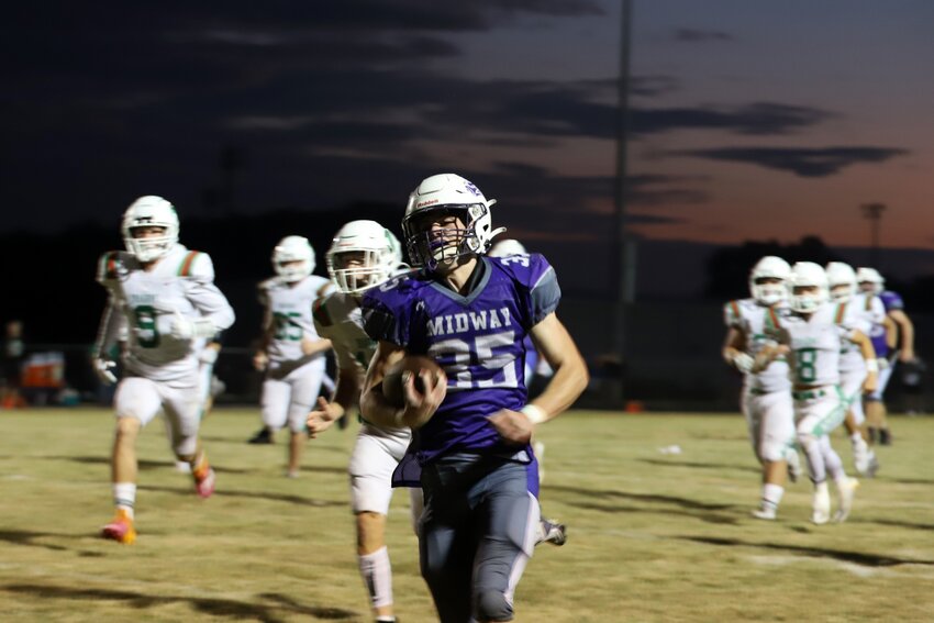 Midway junior running back Trevyn Adams (35) runs to his second touchdown of the night during the third quarter Friday night. The Vikings lost the game, 33-12, dropping their season opener to Mid-Buchanan.