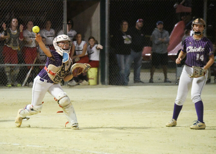 Pleasant Hill freshman catcher JoeE Younce throws to first base in a pickoff attempt during Monday night’s district game at Oak Grove. Odessa beat Pleasant Hill, 5-3, ending the Chicks’ season.