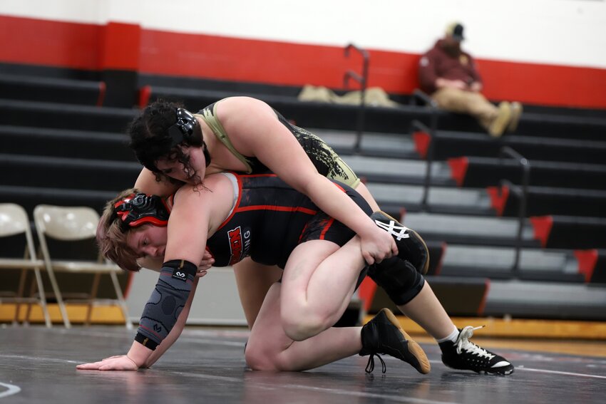 Adrian junior Annabelle Rowe, top, competes against Sherwood senior Kayleen Gareipy during a dual last week. Rowe won the match by an 8-1 decision. Rowe is the defending Class 1 state champion at 235 pounds. Gareipy was a state qualifier last year. Both will be competing at the district tournament this weekend in Nevada.
