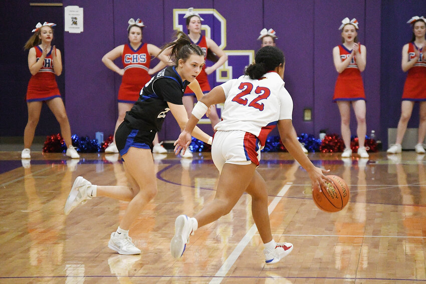 Harrisonville sophomore Maddie Eggers attempts a 3-point shot over two Clinton defenders during last week’s district opener. The Lady Wildcats, who had beaten Clinton by 17 points a week earlier, fell 56-37 in their postseason opener.