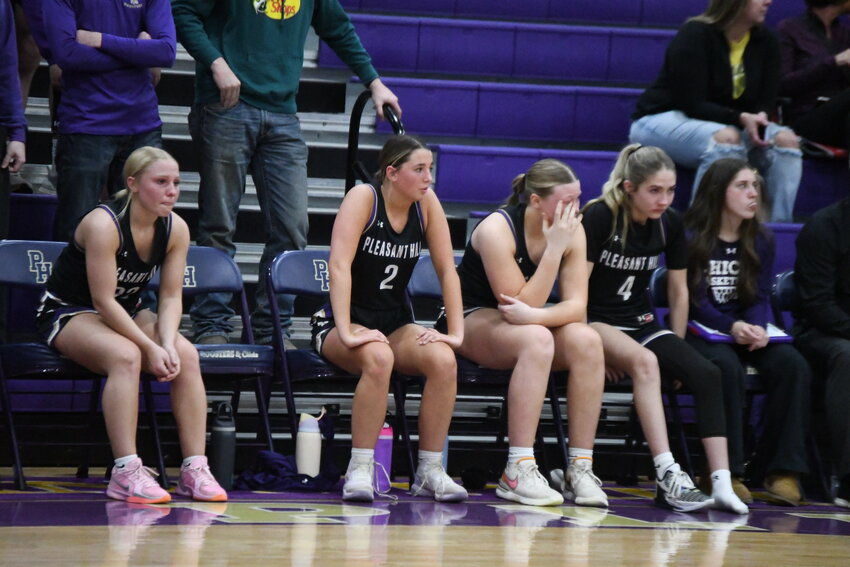 Pleasant Hill girls basketball coach Kyle Reeves talks to his team during last Saturday's district title game.