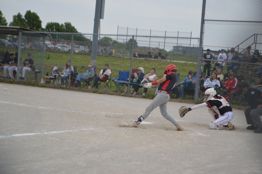 Archie’s Cotton Kilian connects with a pitch for a hit during last week’s home game against Sherwood. The Whirlwinds lost the game 12-8.