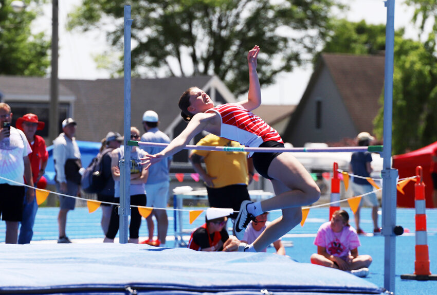 Archie senior Morgan Mattingley attempts to clear the high jump bar during Saturday’s district meet. Mattingley finished second in the event, qualifying for this weekend’s sectional meet, which will be held in Archie.