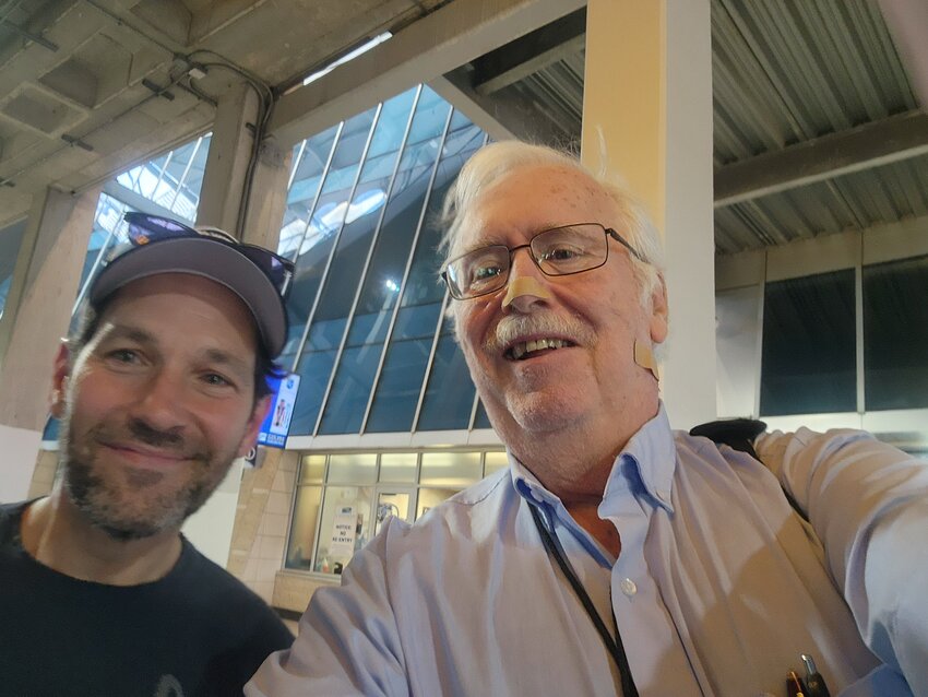 Tribune and Times publisher Dennis Minich, right, and actor Paul Rudd attended Shawnee Mission West High School in Kansas. They meet last week at the "Big Slick" charity softball game.