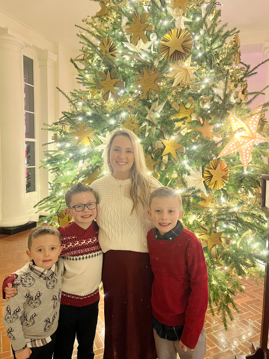 Skylar Martin, second from right, was one of hundreds of applicants chosen to decorate the White House in Washington D.C. Martin and her husband, Kyle Martin are both Pleasant Hill natives. Martin is standing with her three sons, Cohen, 5, Aiden,  7, and Liam, 9, at the Gold Star tree, which is dedicated to the families of soldiers killed in action, during an event Sunday.