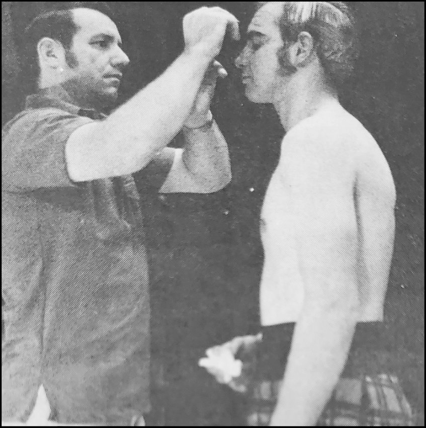 From November 23, 1972 &mdash; Wilfred Schrepel, left, is the &quot;make-up&quot; artist who is preparing Larry Welch, right, for his role in Brigadoon. Dan Farthing, not shown, was the director for the pit band in the production.