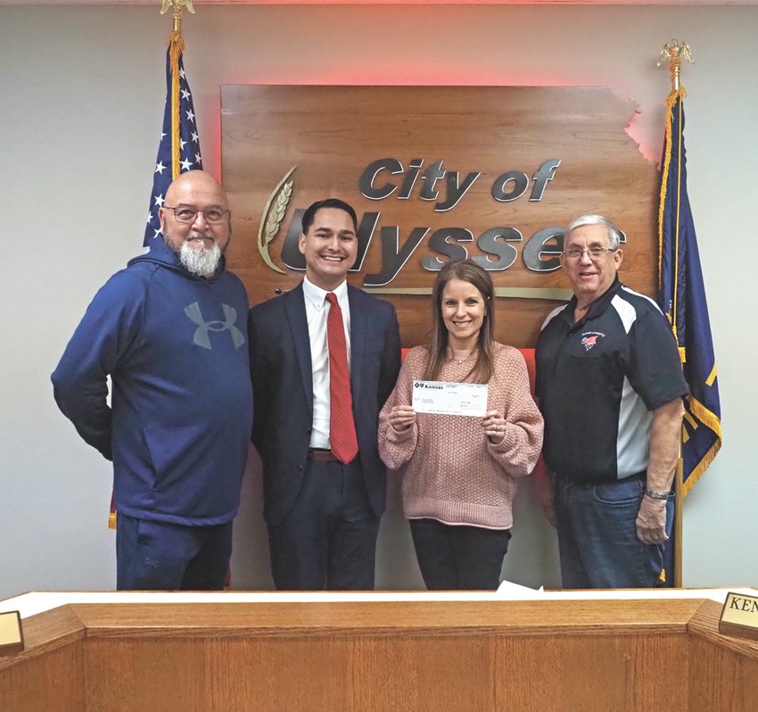 Blue Cross Blue Shield gives Ulysses City a $30,000 grant for use towards the Community Garden Project on February 9. Pictured (l-r): Councilman Mark Diaz, BCBS Agent Aaron Trejo, City Clerk Sarah Britton, and Councilman Ken Warner.