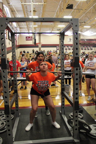 A member of the Ulysses Lady Tiger powerlifting team provides encouragement to a teammate during a lift at the Wichita County Powerlifting meet in February. The Lady TIgers brought home ninth out of 19 teams competing, while the tigers placed 16th and Junior Men's took home fourth.