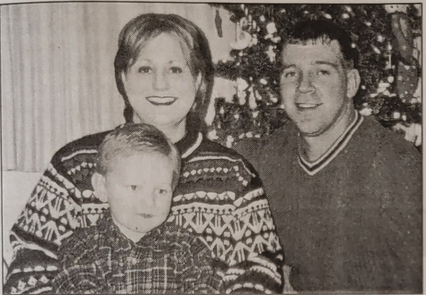 Above: As Seen in the April 3, 2003 Edition of the Ulysses News: Alisha, Connor and Mark Beims were separated by duty. Mark is an Army Reservist called to serve in the Middle East for his country.
