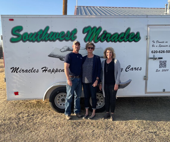 (Left to right) Drew and Katrina Peters,  stand with Kim (Kapp) Tanking in front of the Southwest Miracles trailer. The local couple will be heading up the organization for the Ulysses area. Not pictured are Brandon Peters, Madison Bitter, Elyse Torres and Terry Tanking