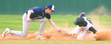 Stryker Berglund, right, slides safely into second base with a stolen base April 1 against Scott City.