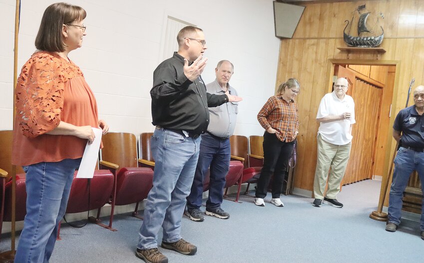 Derik Hockett, second from left, gave a brief history of the Masonic Lodge in Ulysses during last week’s chamber coffee. The lodge has existed in Ulysses for 102 years.